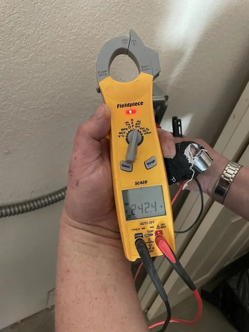 Voltage testing with clamp meter during Ceiling Fan Installation in Chaffee